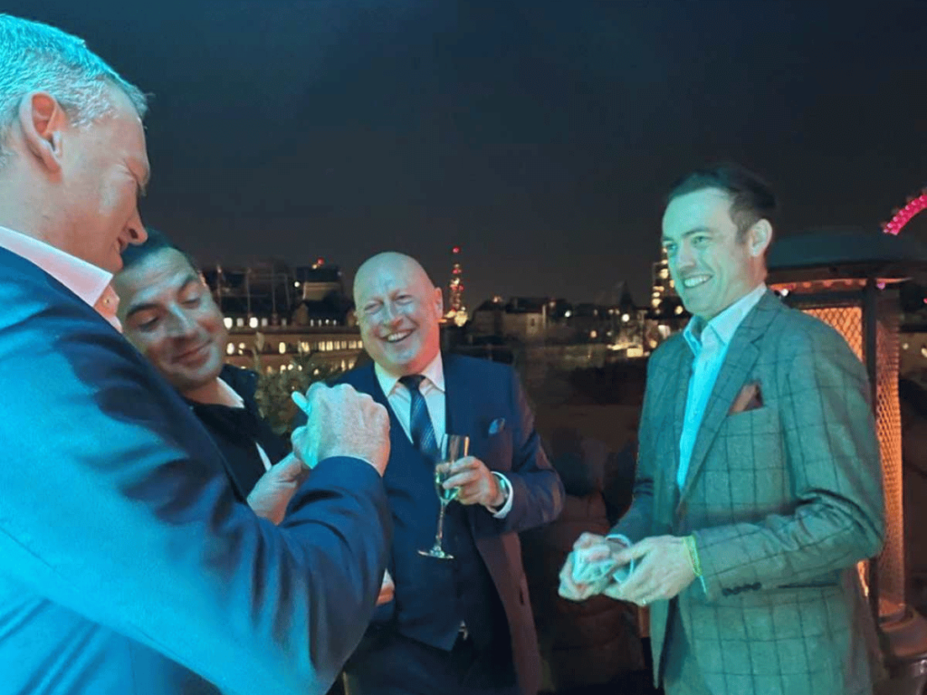 Corporate Magician London Brendan Patricks wows a group on a London evening